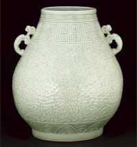 19th century A Chinese carved celadon hu vase
